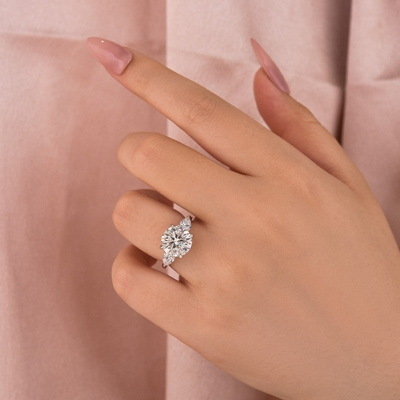 Moissanite 4.0 Ct Round Cut White Gold Engagement Ring with Pear Cut Side Stone