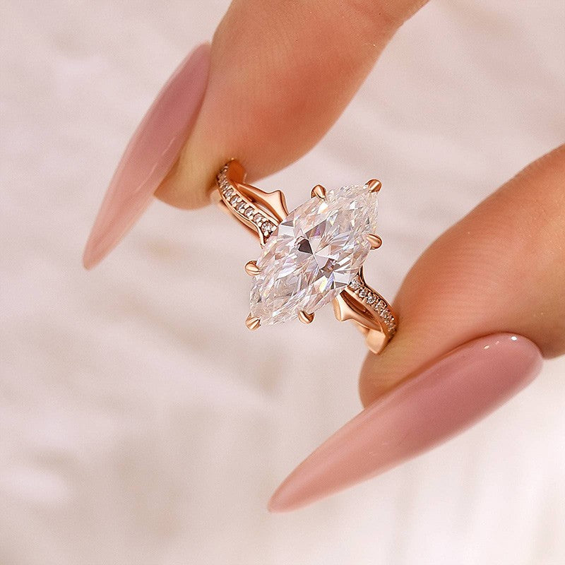 Moissanite 3.0Ct Marquise Cut Rose Gold Twist Engagement Ring In Sterling Silver
