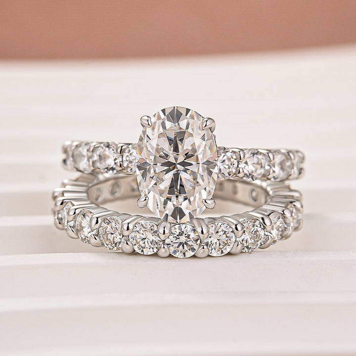 Moissanite 2.5Ct Oval Cut Side Stone White Gold Engagement Ring with Pavé Eternity Ring
