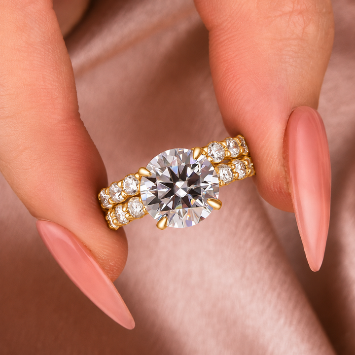 Detailed view of the round moissanite bridal set held between fingers