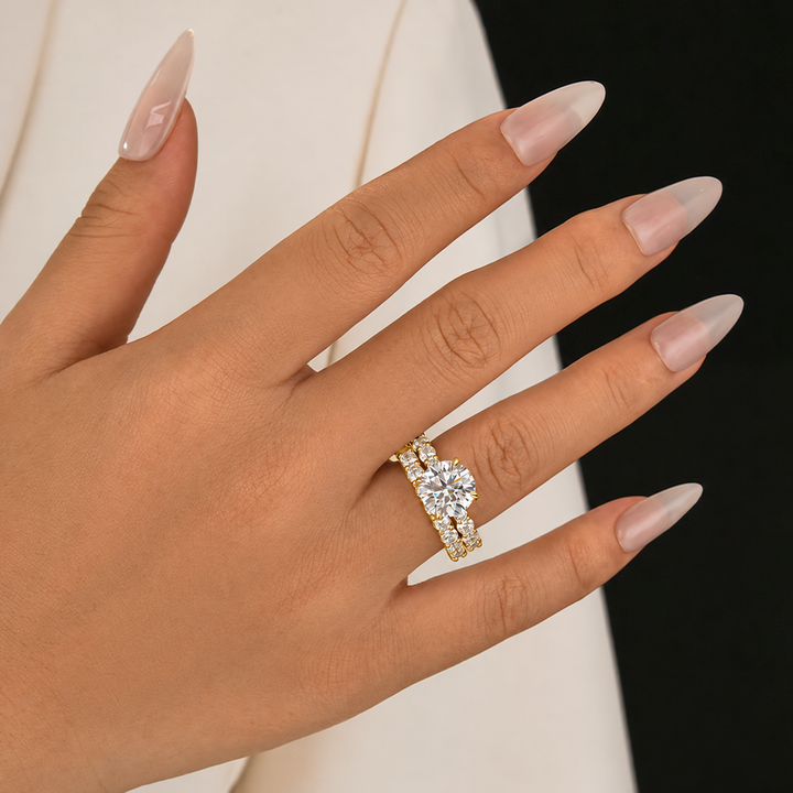Round cut moissanite bridal set displayed on a neutral surface