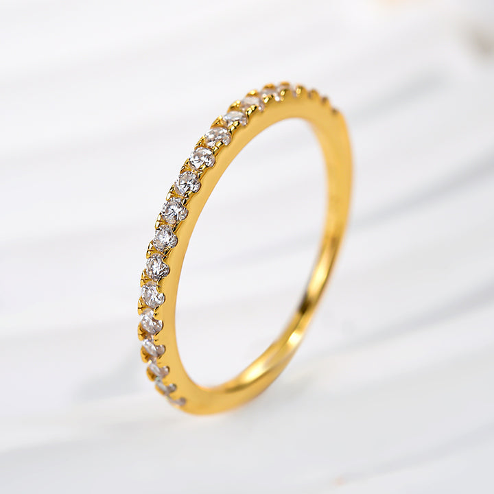 Side view of a round stone yellow gold anniversary band