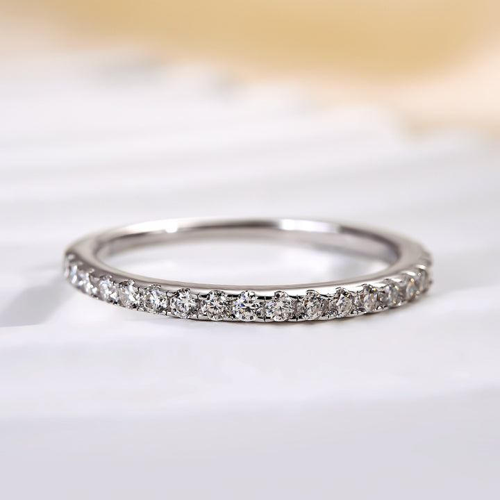 Front view of a round moissanite half halo anniversary ring