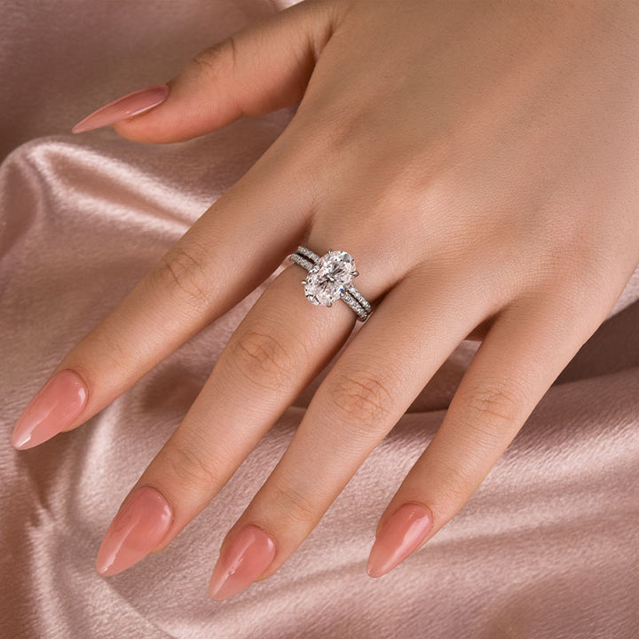 Half halo anniversary ring shown on hand from an angled view
