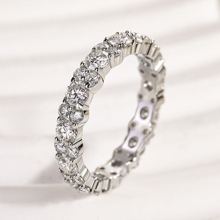Side view of a white moissanite full eternity band