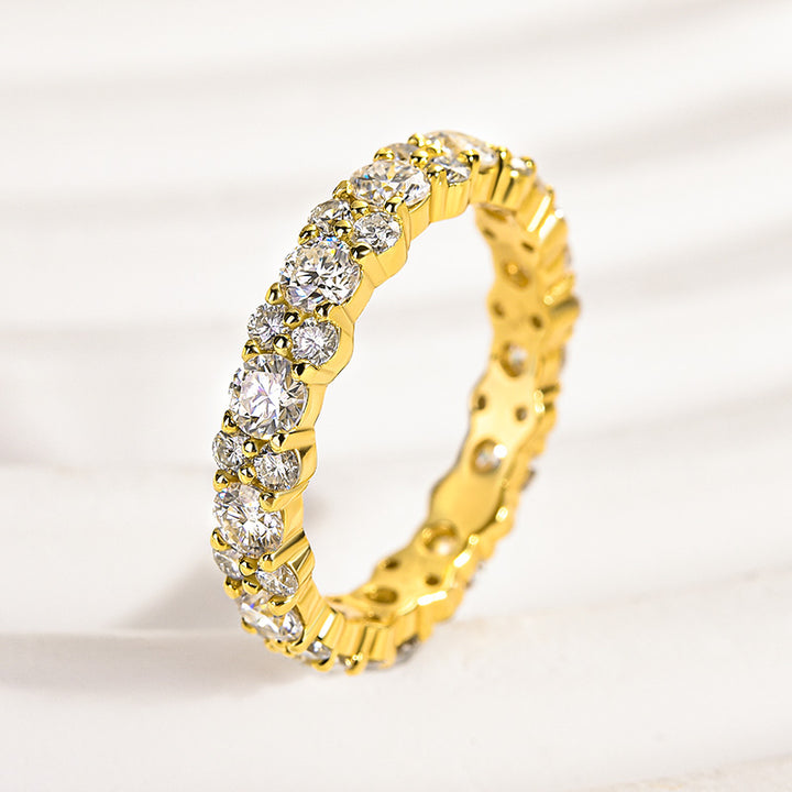 Side view of a yellow gold moissanite full eternity band