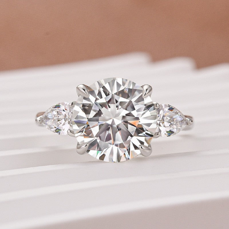 Moissanite 4.0 Ct Round Cut White Gold Engagement Ring with Pear Cut Side Stone