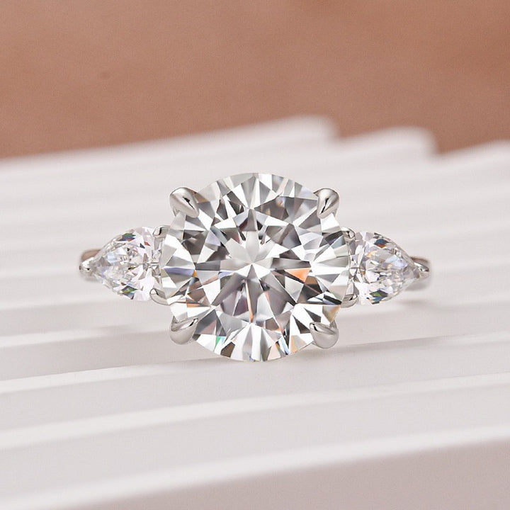 Moissanite 4.0 Ct Round Cut White Gold Engagement Ring with Pear Cut Side Stone