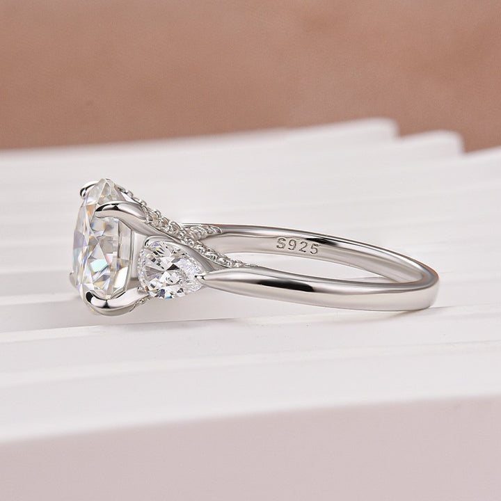 Moissanite 4.0 Ct Round Cut White Gold Engagement Ring with Pear Cut Side Stone