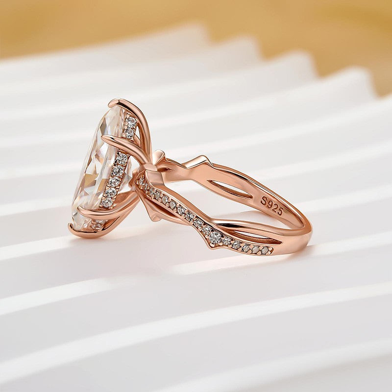 Moissanite 3.0Ct Marquise Cut Rose Gold Twist Engagement Ring In Sterling Silver