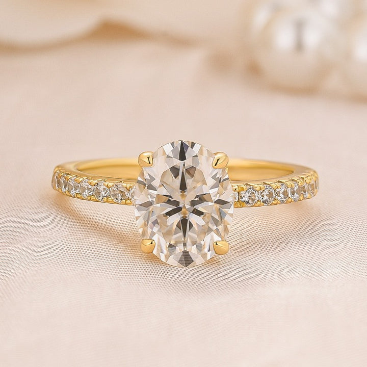 Front view of an oval pavé moissanite promise ring