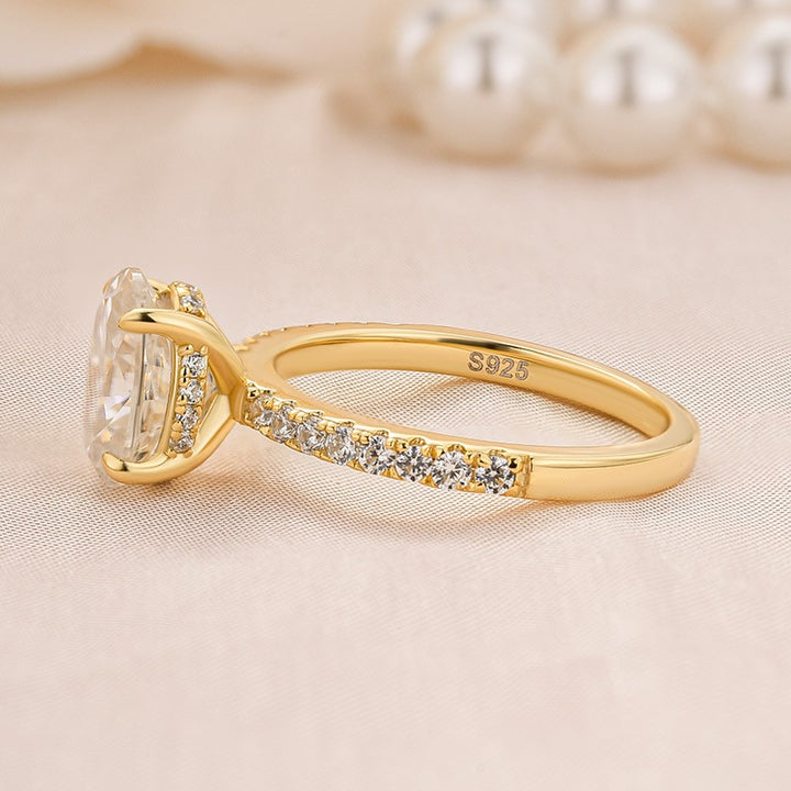 Side profile of the oval moissanite ring and pavé band
