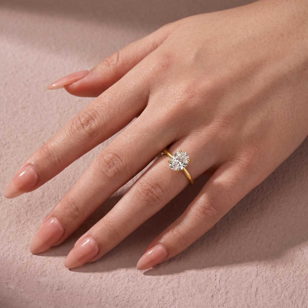 Yellow gold oval moissanite ring styled for everyday wear